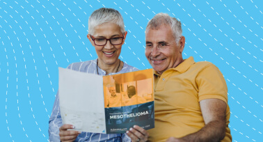 Elderly couple looking at mesothelioma packet.