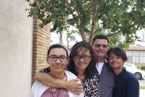 Mesothelioma survivor Kim Madril with her family